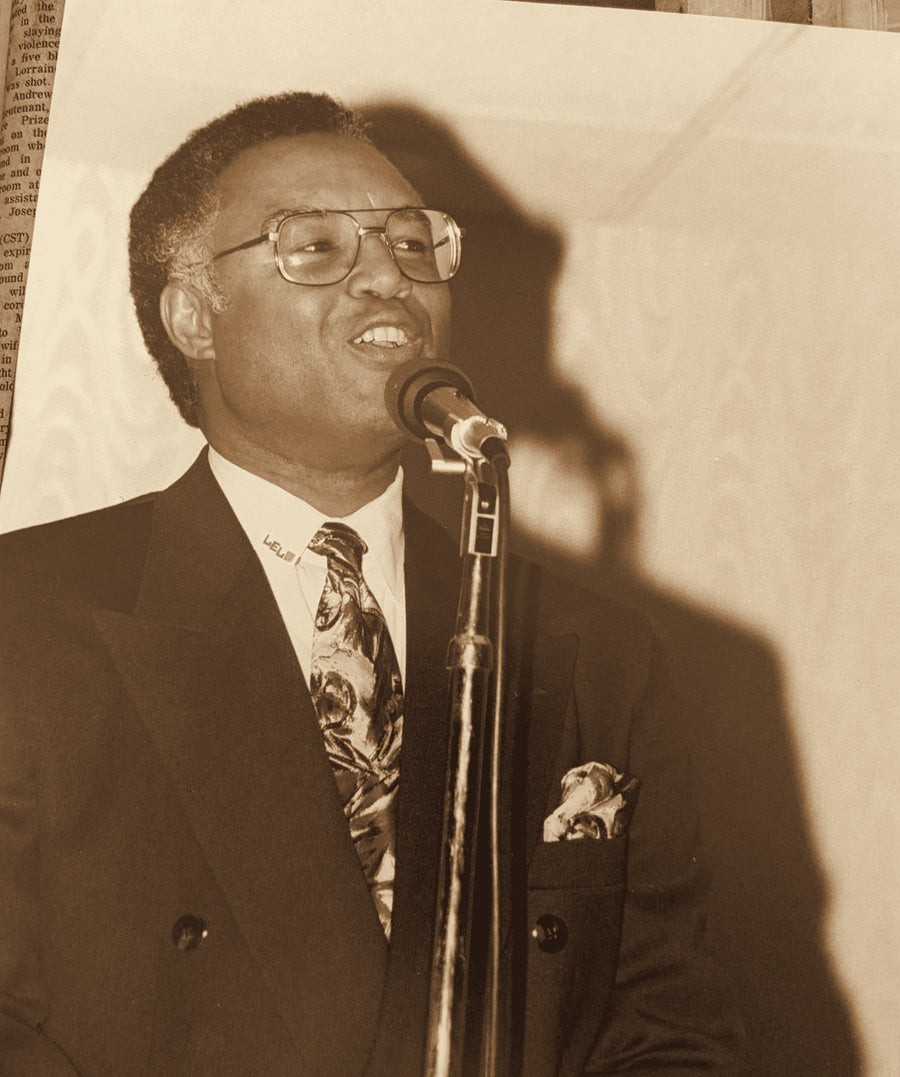 Lou Lampley speaking at a podium