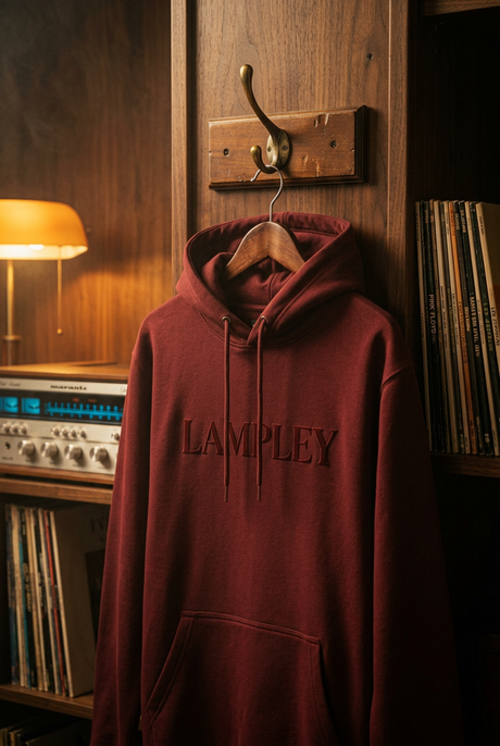 The Lampley burgundy hoodie hanging beside a vintage hi-fi stereo and vinyl records