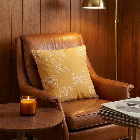 Matika mudcloth pillow in mustard in a vintage den